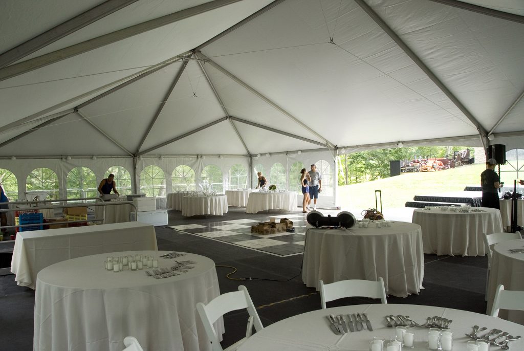 View from under 40' x 60' wedding tent on top of level stage