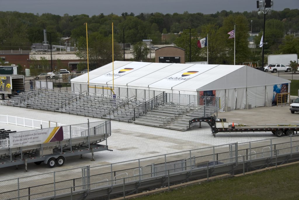 Bleachers and clearspan tents at Ashford University graduation ceremony