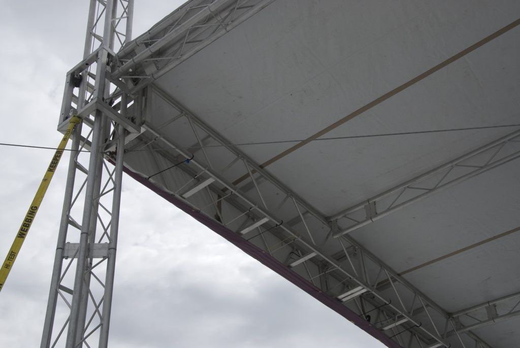 Truss roof above stage at Ashford University graduation ceremony
