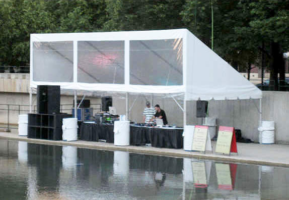 Our 15' x 30' Awning/Pavilion "frame" tent is set-up pool side for a live DJ performance.