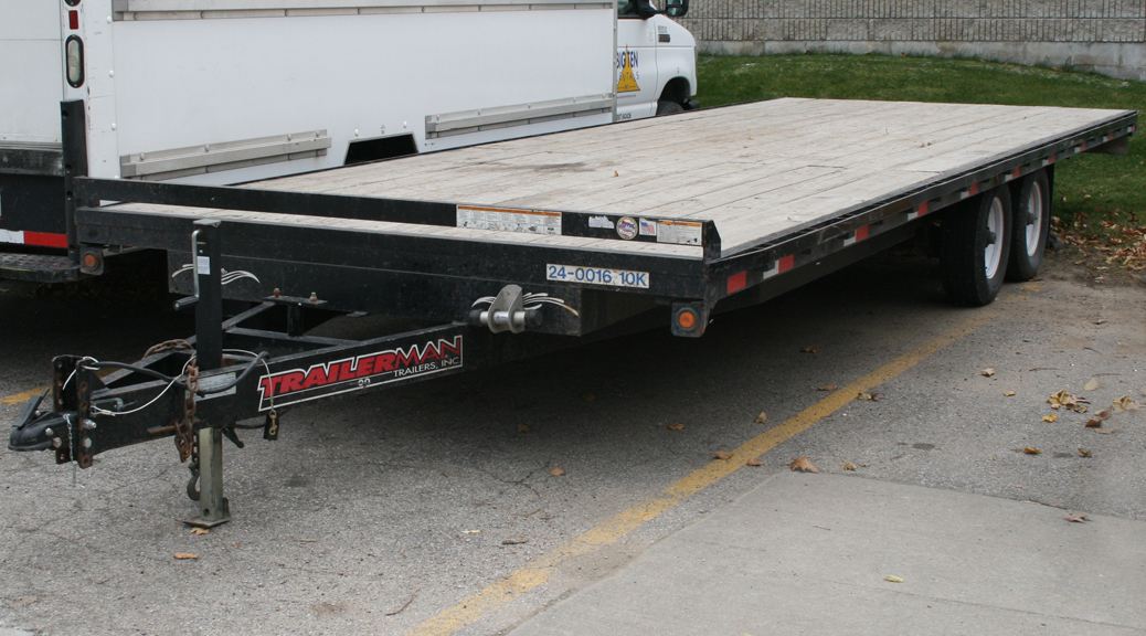 24' 10,000 lb. Flatbed trailer rental: Tandem axle, wood 