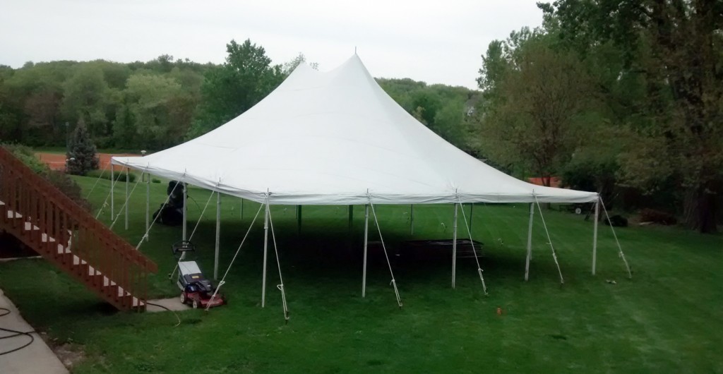 Above view of 30' x 40' Rope and Pole tent setup for a backyard high school graduation party.