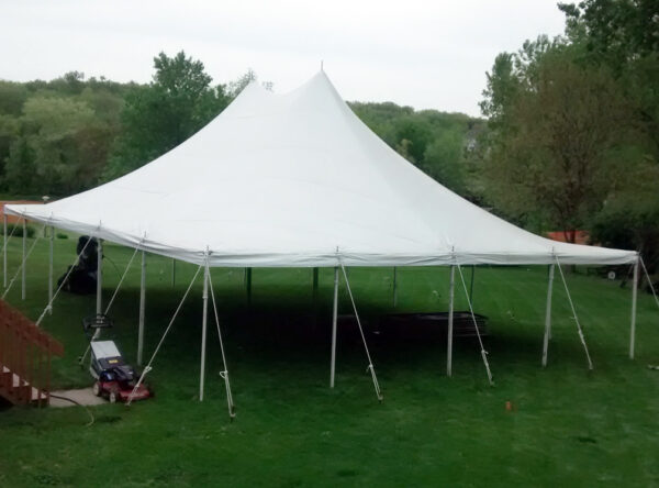 Above view of 30' x 40' Rope and Pole tent setup for a backyard high school graduation party. Above view of 30' x 40' Rope and Pole tent setup for a backyard high school graduation party.