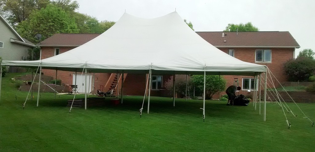 30' x 40' Rope and Pole tent setup for a backyard high school graduation party.