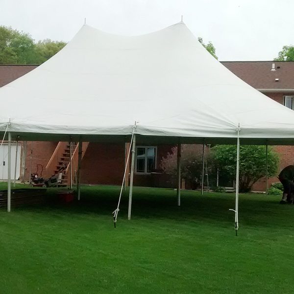 30' x 40' Rope and Pole tent setup for a backyard high school graduation party.