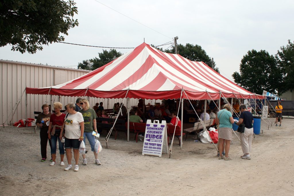 30' x 60' red and white rope and pole tent