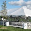 Outside 30' x 75' frame tent with on French Sidewalls on far sides.