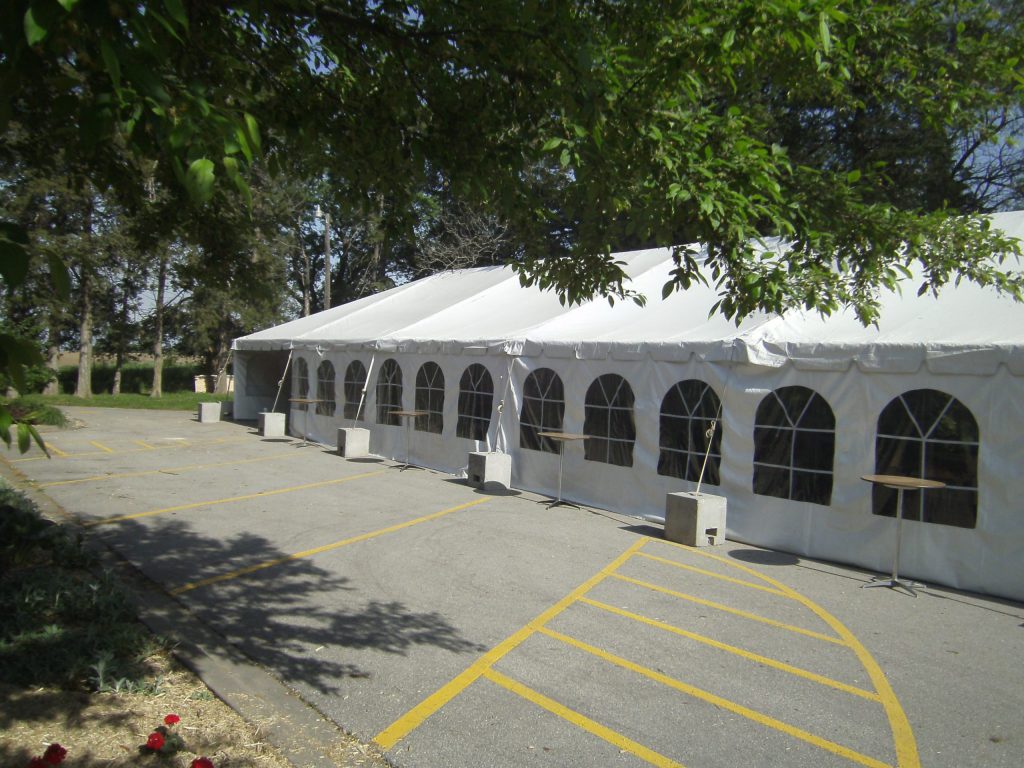 Outside of our 30' x 90' Frame tent with french side walls.
