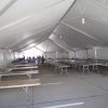 Inside view of a 40' x 100' hybrid tent with Banquet Tables.