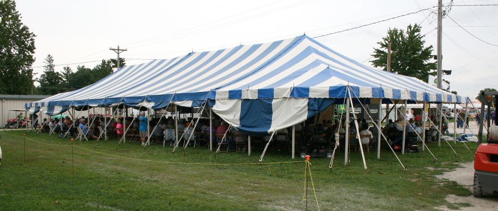 40' x 100' blue and white rope and pole tent with stage