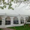 40' x 60' rope and pole tent with french window sidewalls being attached.