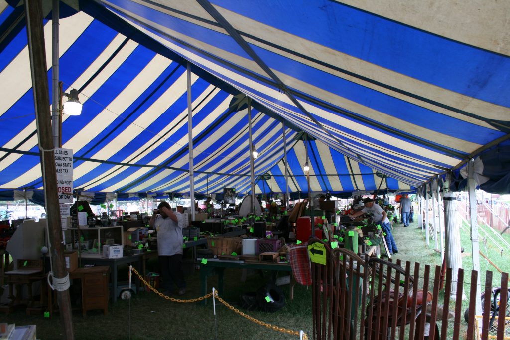 Collectible swap meet under the 40ft x 100ft blue and white rope and pole tent
