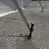 Drill and Fill Tent Stake in pavement or asphalt (close-up)