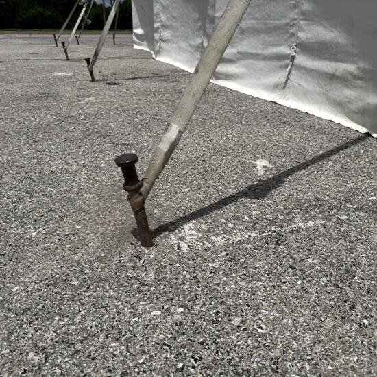 Drill and Fill Tent Stake in pavement or asphalt (close-up)