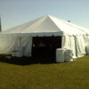 Entrence of 30' x 30' frame tent with water barrels