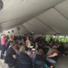 Guests at the weddding reception under 30' x 90' frame tent