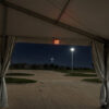 Illuminated exit sign rental in a clearspan tent (AI)
