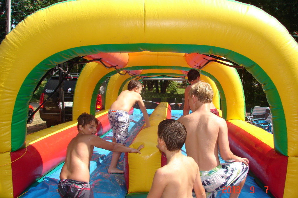 Kids Walking On Dual Lane Slip N Slide Inflatable Iowa City