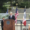 Tim Cook of Apple INC in Waukee, Iowa talks about data centers. Stage, flags, chairs, stanchions, .etc by Big Ten Rentals