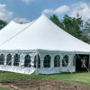 View of 60' x 90' Genesis rope and pole tent in Wedding in Wellman, Iowa. With Frence sidewalls attached.