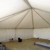 Left: 30' x 30' frame tent. Right: 40' x 40' hybrid tent with solid sidewalls.