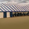 Outside of the 60' x 150' Gala rope and pole tent for rent.