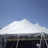 Staking at the corner of the 80' x 150' Rope and Pole event tent.