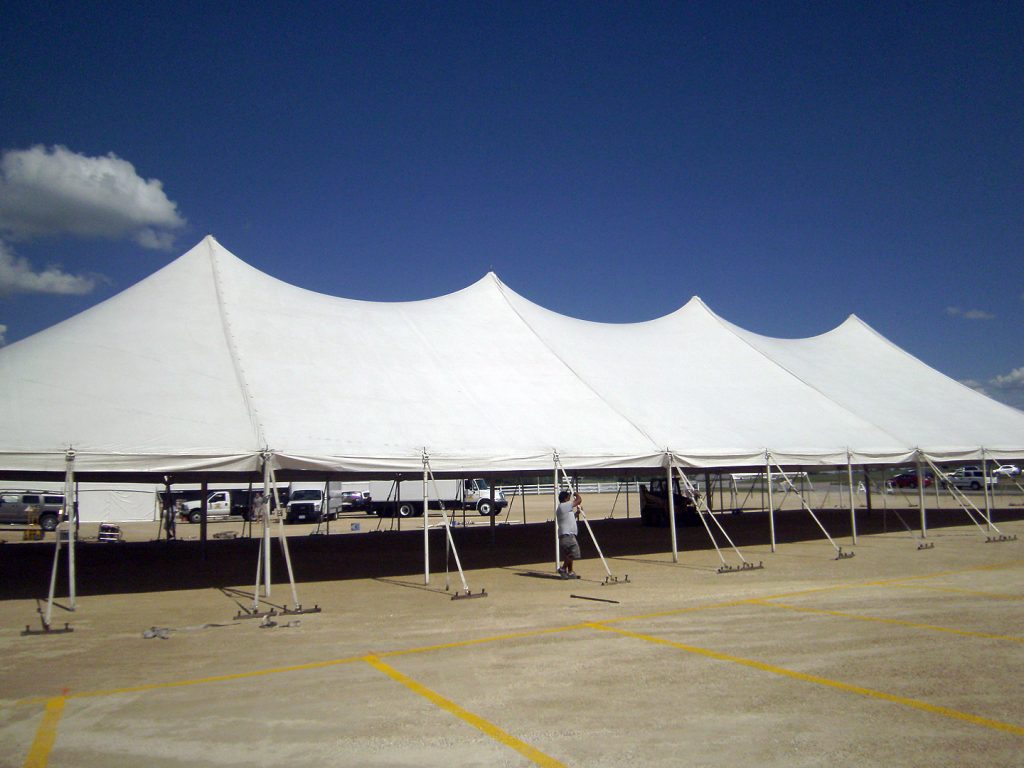side view of 60' x 150' Rope and Pole tent made by Genesis located at the 2014 JC Cycles event.