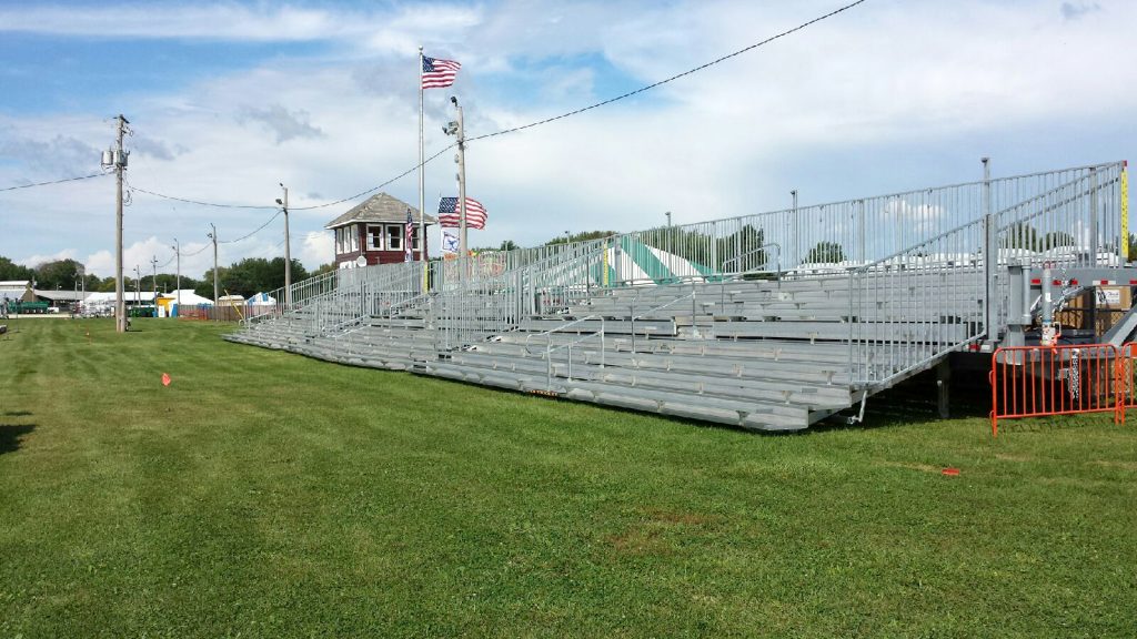 Three sets of 45' long, 10-Row Hydraulic Bleachers in a line.