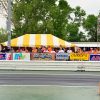 Yellow and White 20' x 30' Frame tent at the Cordova dragstrip in Illinois.