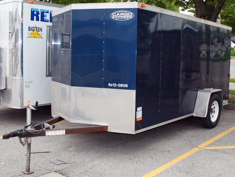Left side of the blue 6' x 12' enclosed utility trailer.