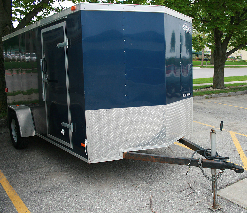 Blue 6'x12' enclosed cargo utility trailer rental: IC & CR Iowa