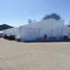 18m x 50m Losberger-made Clearspan Structure with 10x10 frame tent and heaters.
