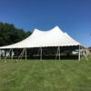Outside at the end of 60′ x 90′ “Twin-Pole” Legend rope and pole tent