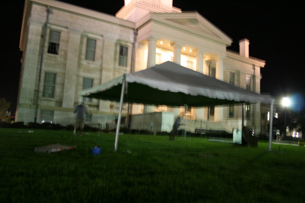 Frame tent on the lawn of Iowa Old Capitol Building