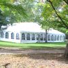 40' x 80' hybrid tent and 20' x 20' frame tents in woods