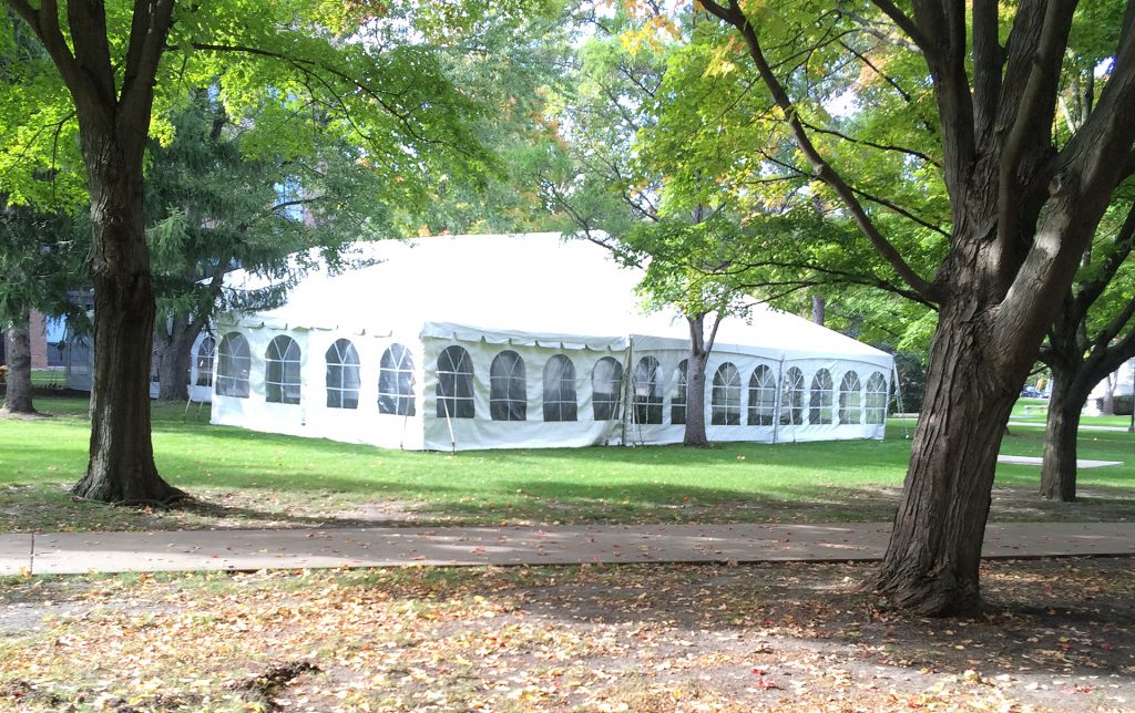 40' x 80' hybrid tent and 20' x 20' frame tents in woods
