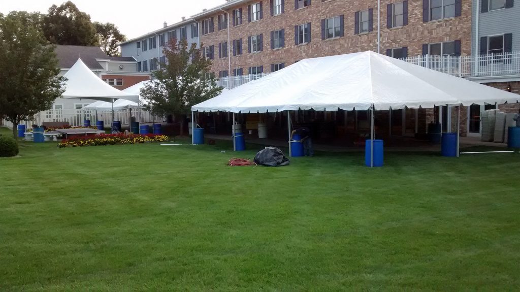 Multiple frame tents set up for event at retirement home