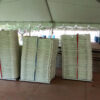 Folding white chairs for event under frame tent