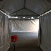 Inside enclosed motorcade tent tunnel's walkway.