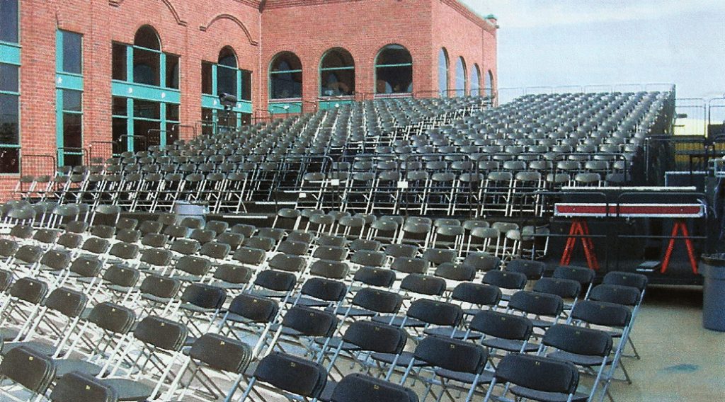 Tiered stage rental with chairs