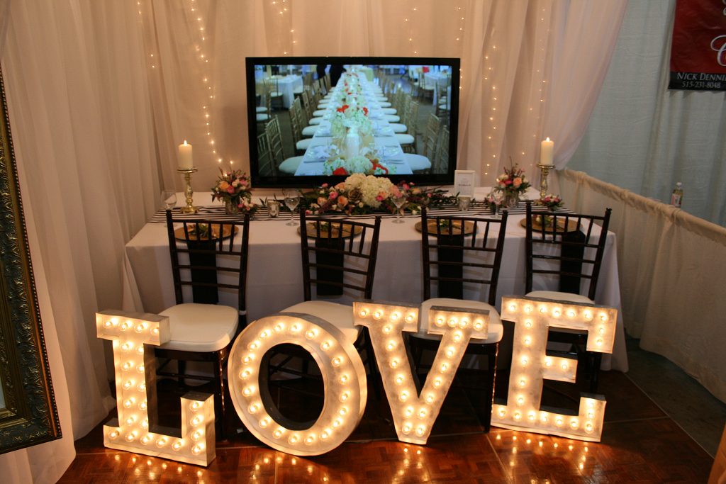 Wedding Booth with flowers and lighting
