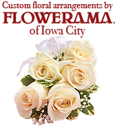 The stunning floral arrangements for our booth were custom created by the staff at Flowerama in Iowa City.