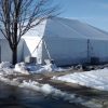 Set-up of the side of the 40' x 60' hybrid tent with entry way