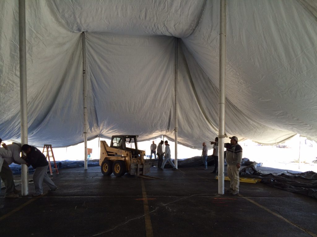 80' x 90' rope and pole tent set-up for Saint Patrick's Day in Iowa