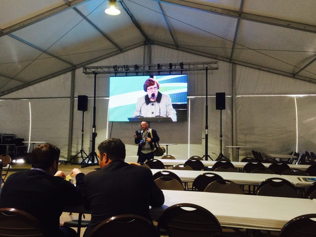 Projection screen setup inside clearspan tent at 2015 Iowa Ag Summit
