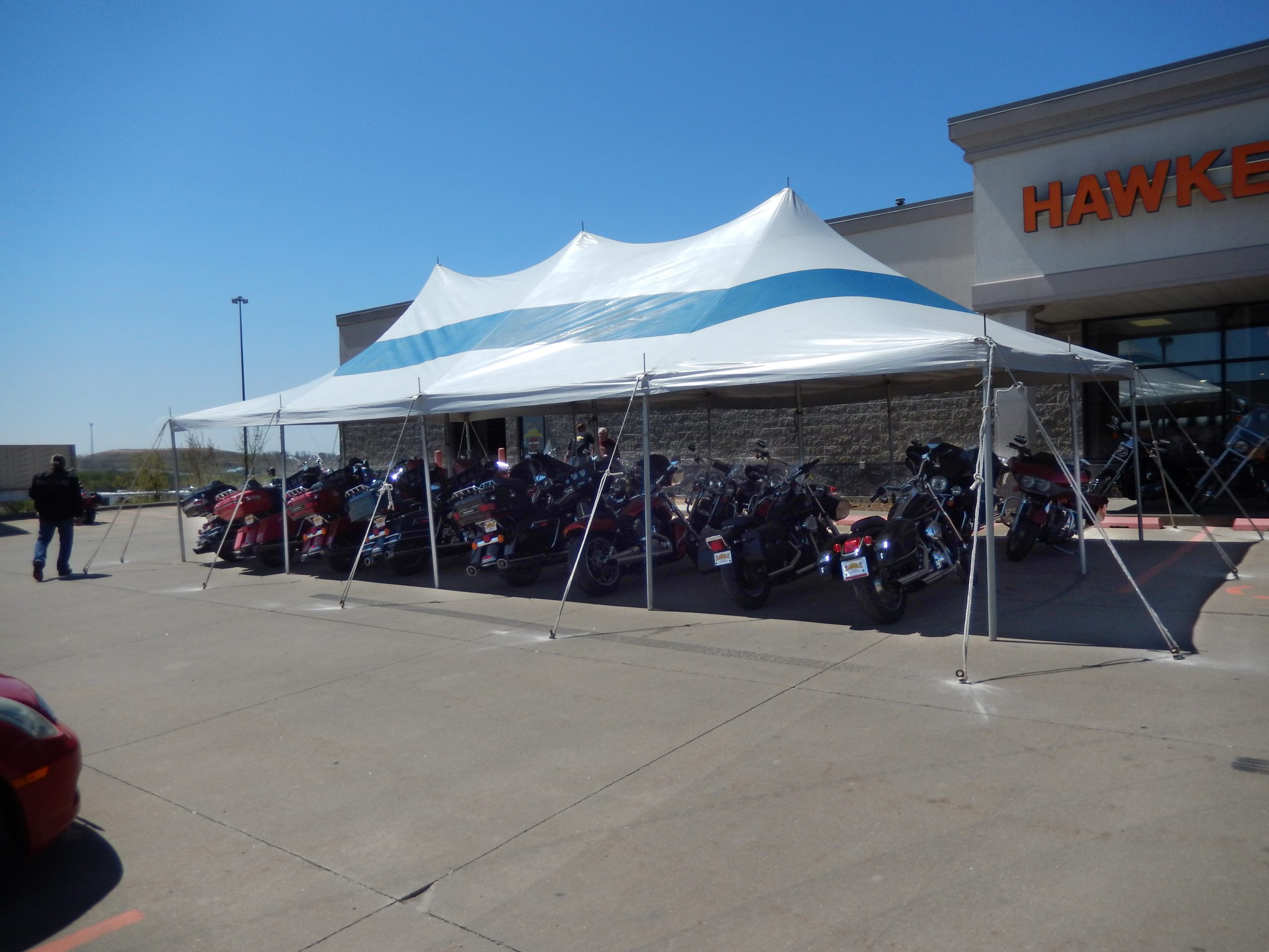 Bikes under event tent at McGrath Hawkeye Harley-Davidson