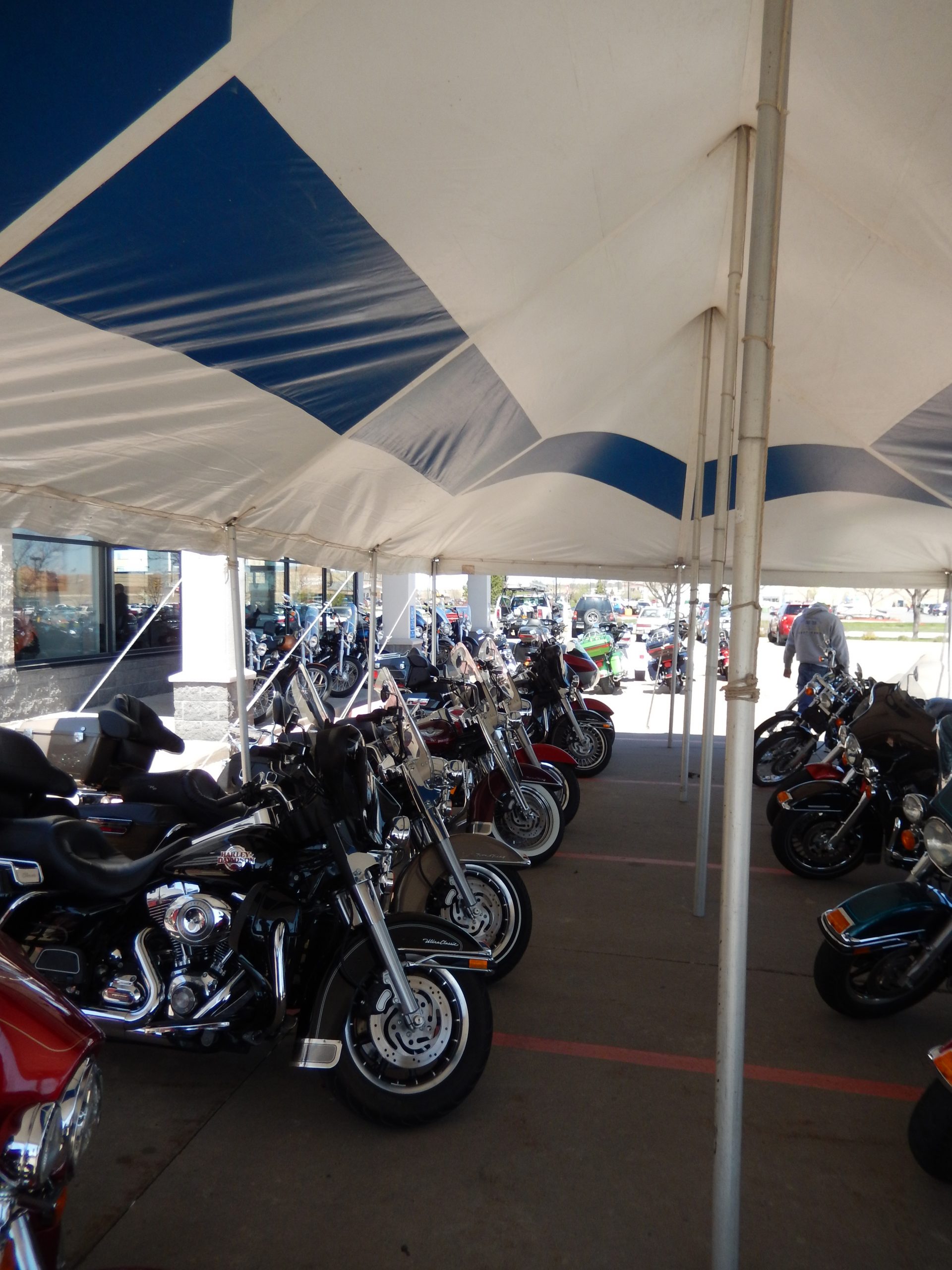 Motorcycles under tent at McGrath Hawkeye Harley-Davidson