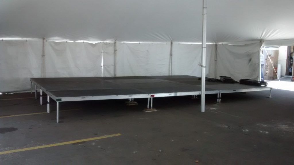 Single level stage under 40' x 140' rope and pole tent at restaurant for Cinco de Mayo