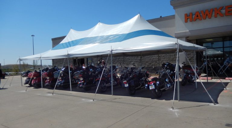 Set-up for McGrath Auto used car/motorcycle tent event in Iowa